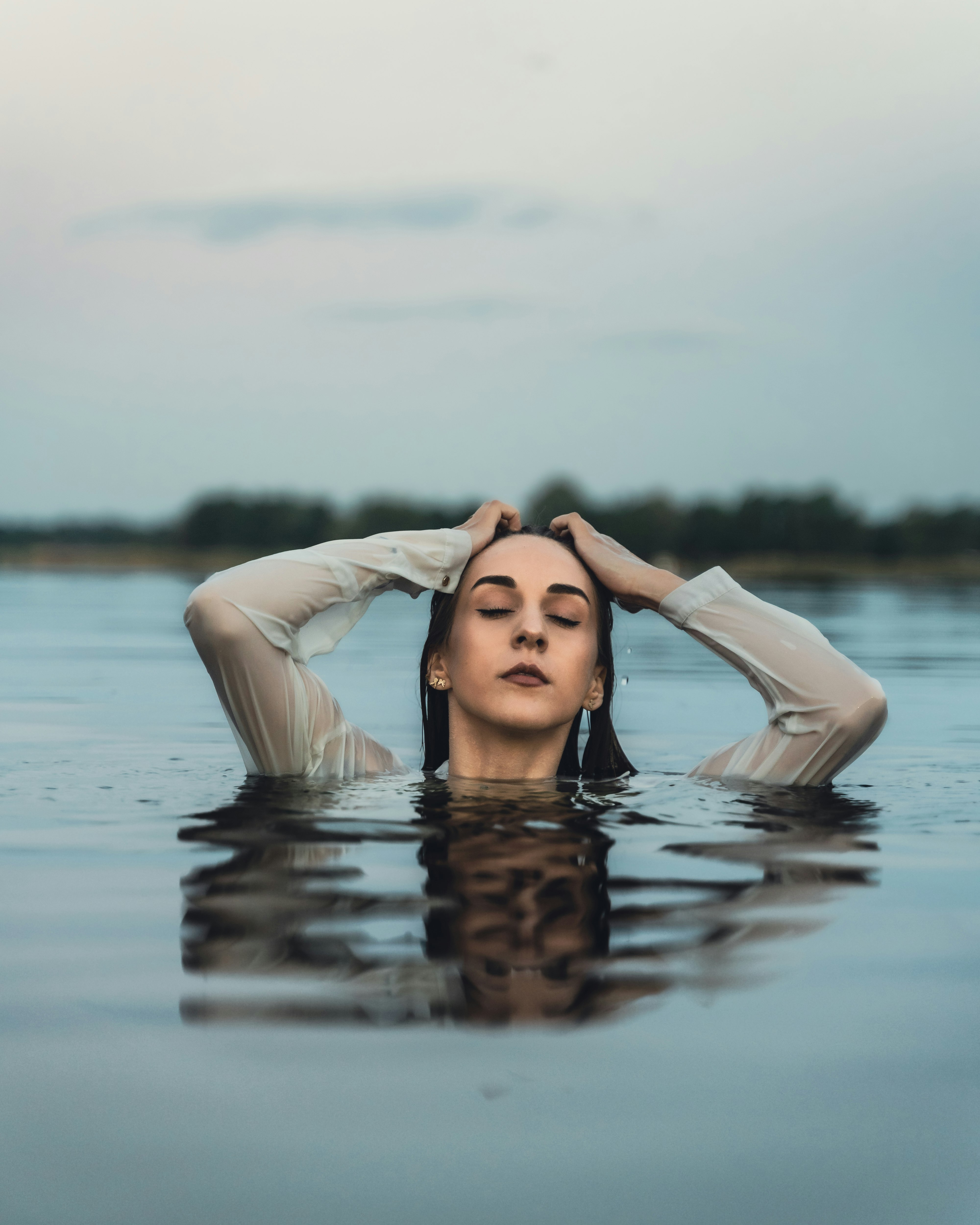 woman in white tank top on water